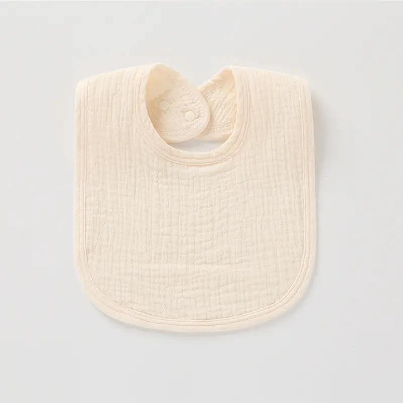 Joli bavoir ivoire ajustable en mousseline de coton
