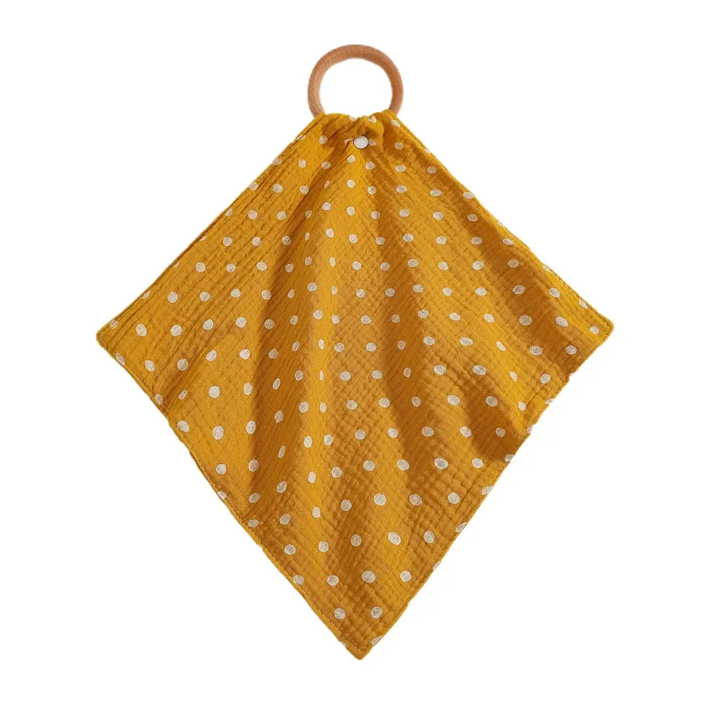 Yellow cotton bib with small white polka dots